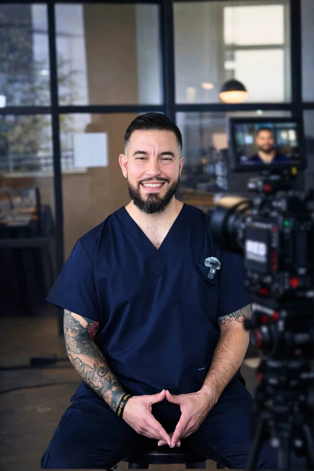 A physician filming medical explainers. Production photography from the supplied medical work.